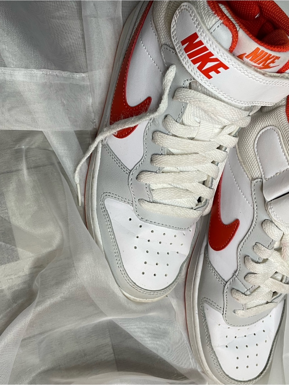 Nike White and Red Mid/High Top Sneakers with Bold Swoosh